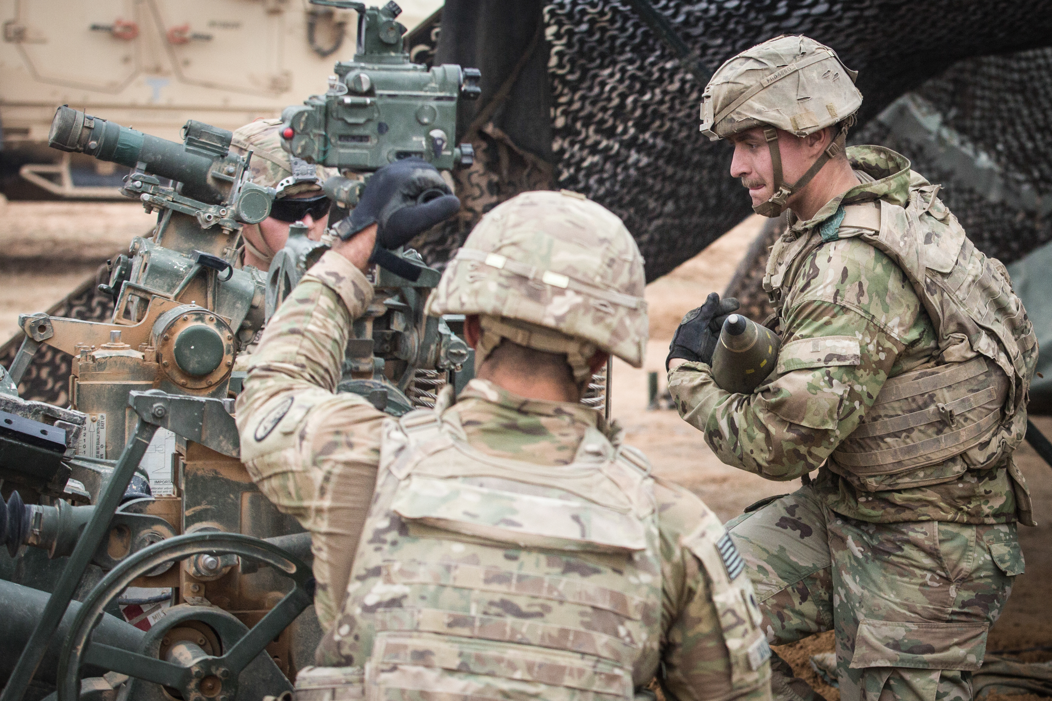 A US Army soldier carries a 155mm artillery shell on Firebase Saham, Iraq, 021218 Op Inherent Resolve CREDIT DVIDS