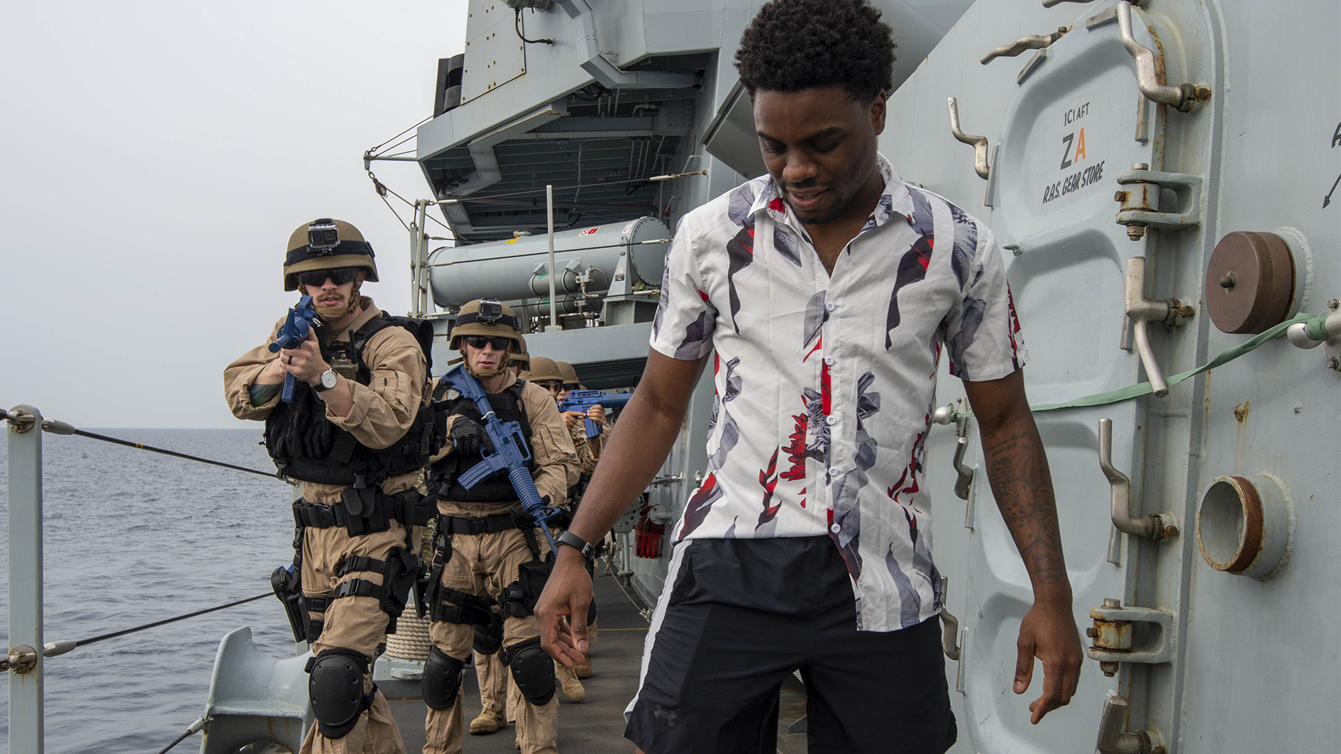 A US Board and Search team apprehend a 'smuggler' on board HMS Lancaster CREDIT ROYAL NAVY