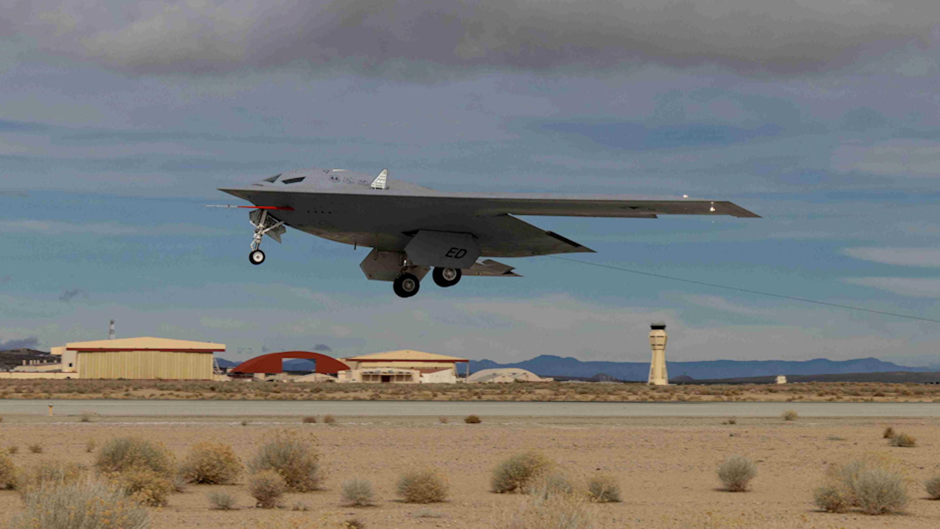 A USAF B-21 Raider stealth bomber taking off during flight testin