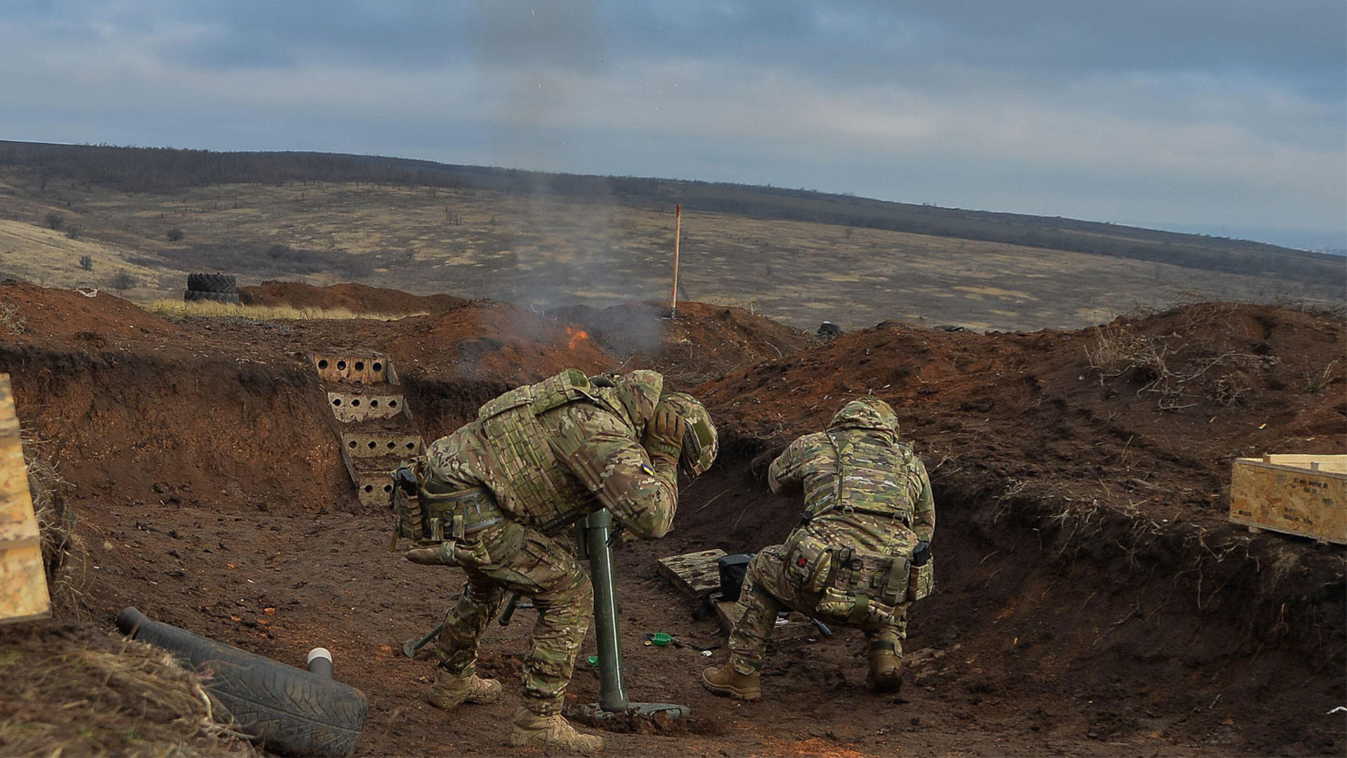 A Ukrainian mortar crew fires during training in Donetsk region