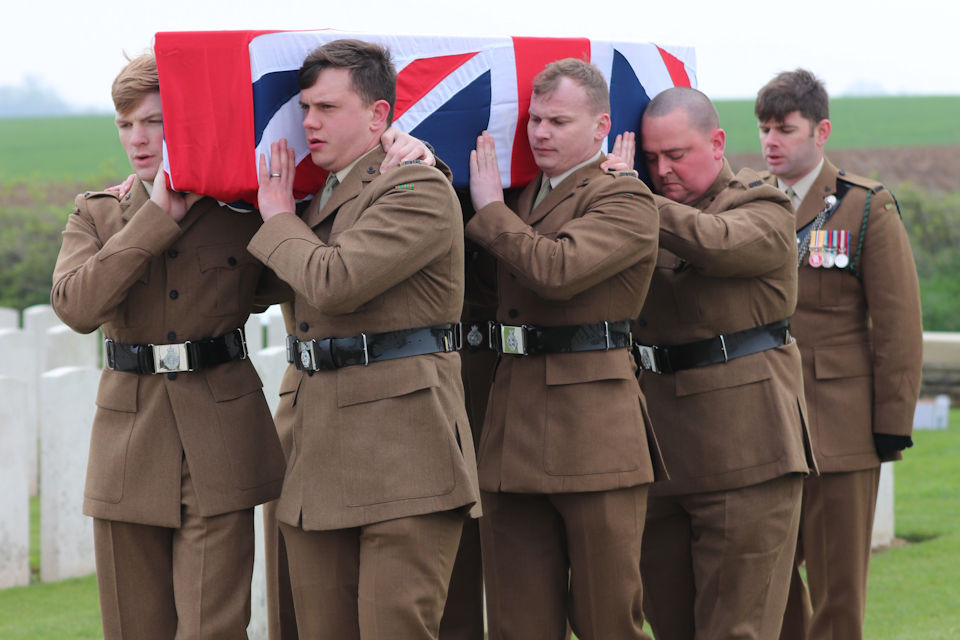 A bearer party from 1 RIFLES carry Private Burt’s coffin (Picture: Crown Copyright).