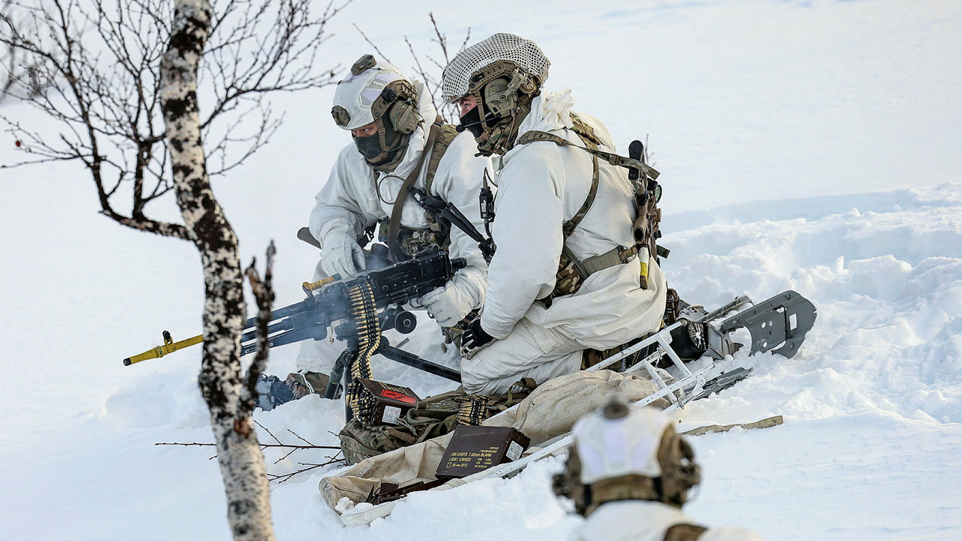 A belt of 7.62x51mm blank ammunition is fed into the Jimpy mounted on its tripod ready for action - note the yellow BFA and yellow barrel-changing handle to signify its blank-firing status