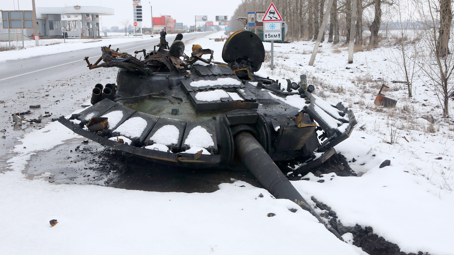 A blown-off tank turret lies on the ground outside Kharkiv, north-east Ukraine, days after Russia launched its invasion