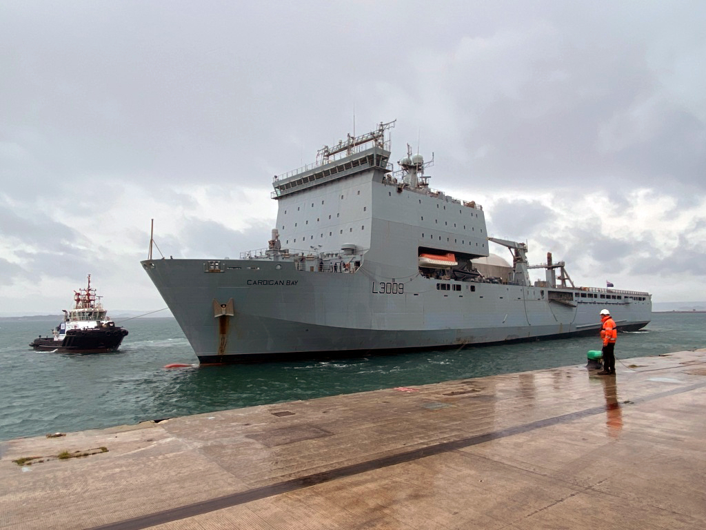 A dockyard worker at Portland waits for RFA Cardigan Bay to berth