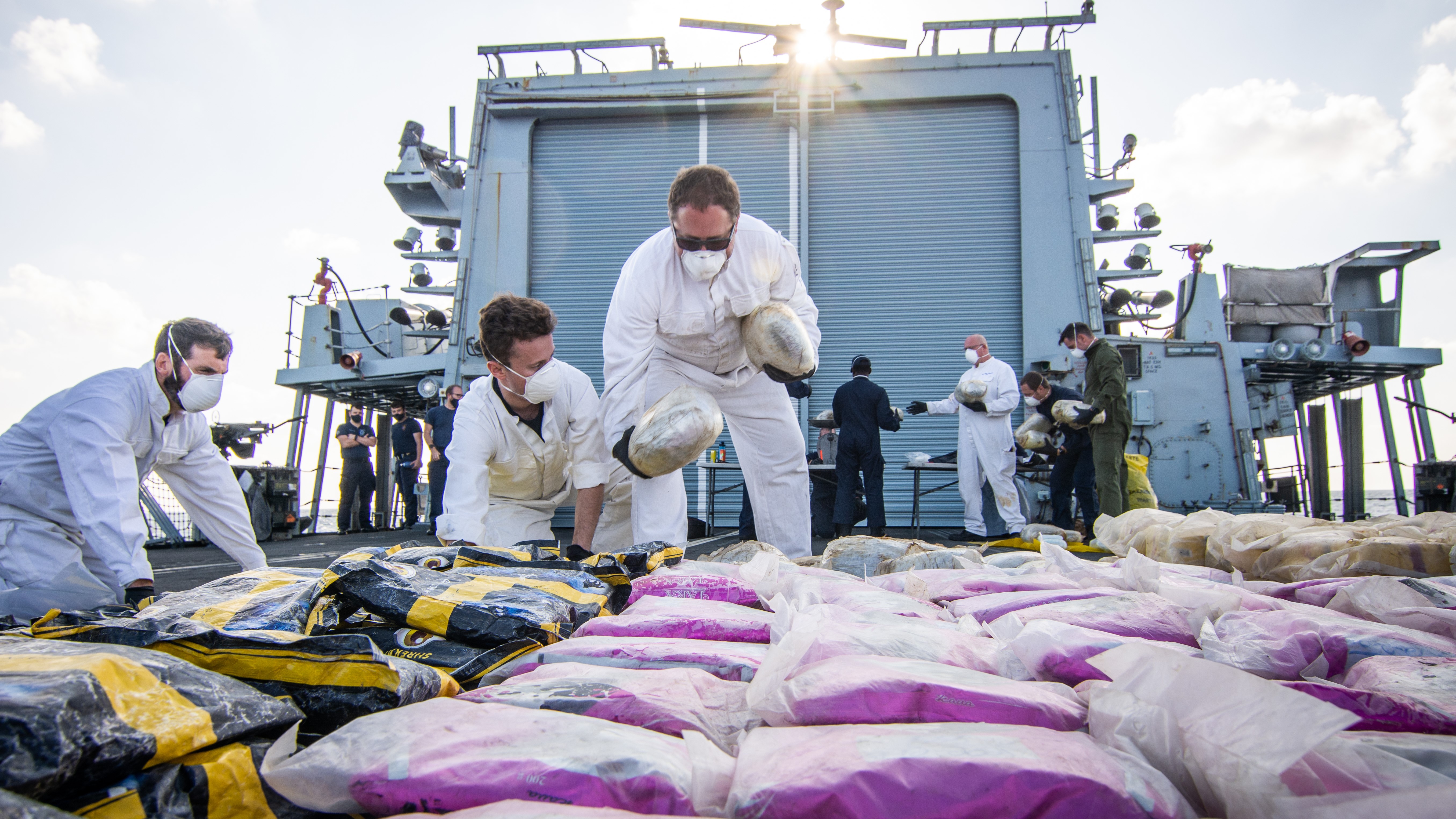 A drugs haul is laid out on Montrose's flight deck CREDIT Royal Navy 