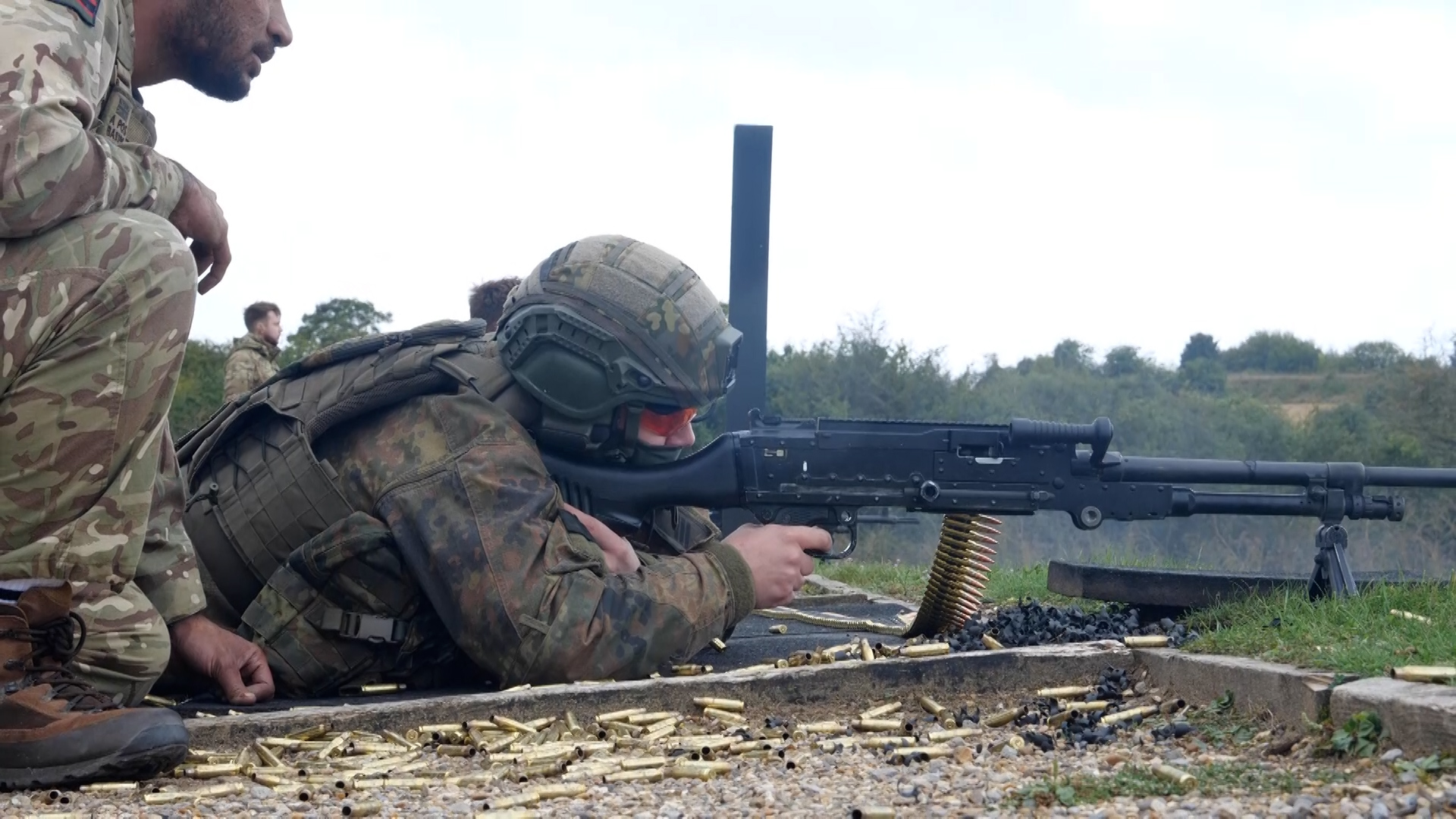 Member of the German Fallschirmjäger regiment firing the GPMG (General Purpose Machine Gun) during training