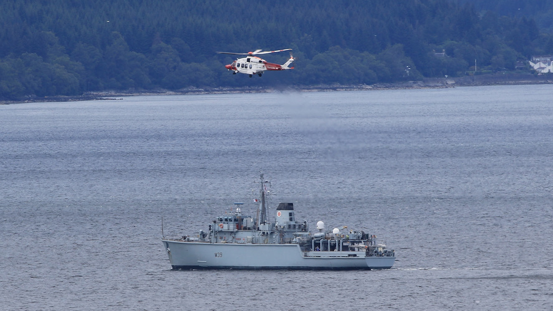 A helicopter is seen above HMS Hurworth as she prepares for NATO minehunting (Picture: Royal Navy).