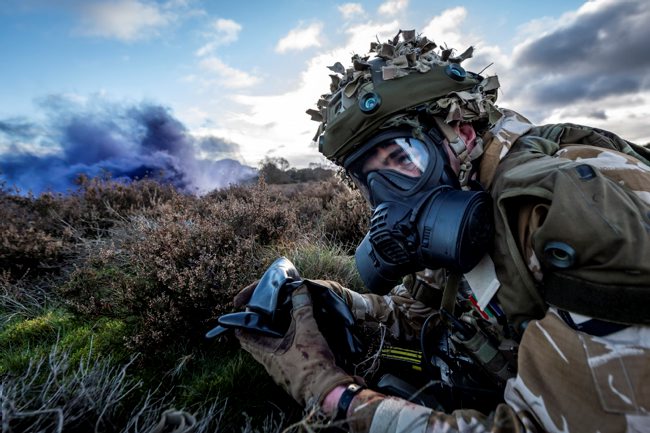 A member of 1st Battalion Scots Guards sets himself for a CBRN attack scenario on Ex SHADER TEMPEST as the Scots Guards carry out final preparations ahead of deployment on Op SHADER 121120 CREDIT MOD