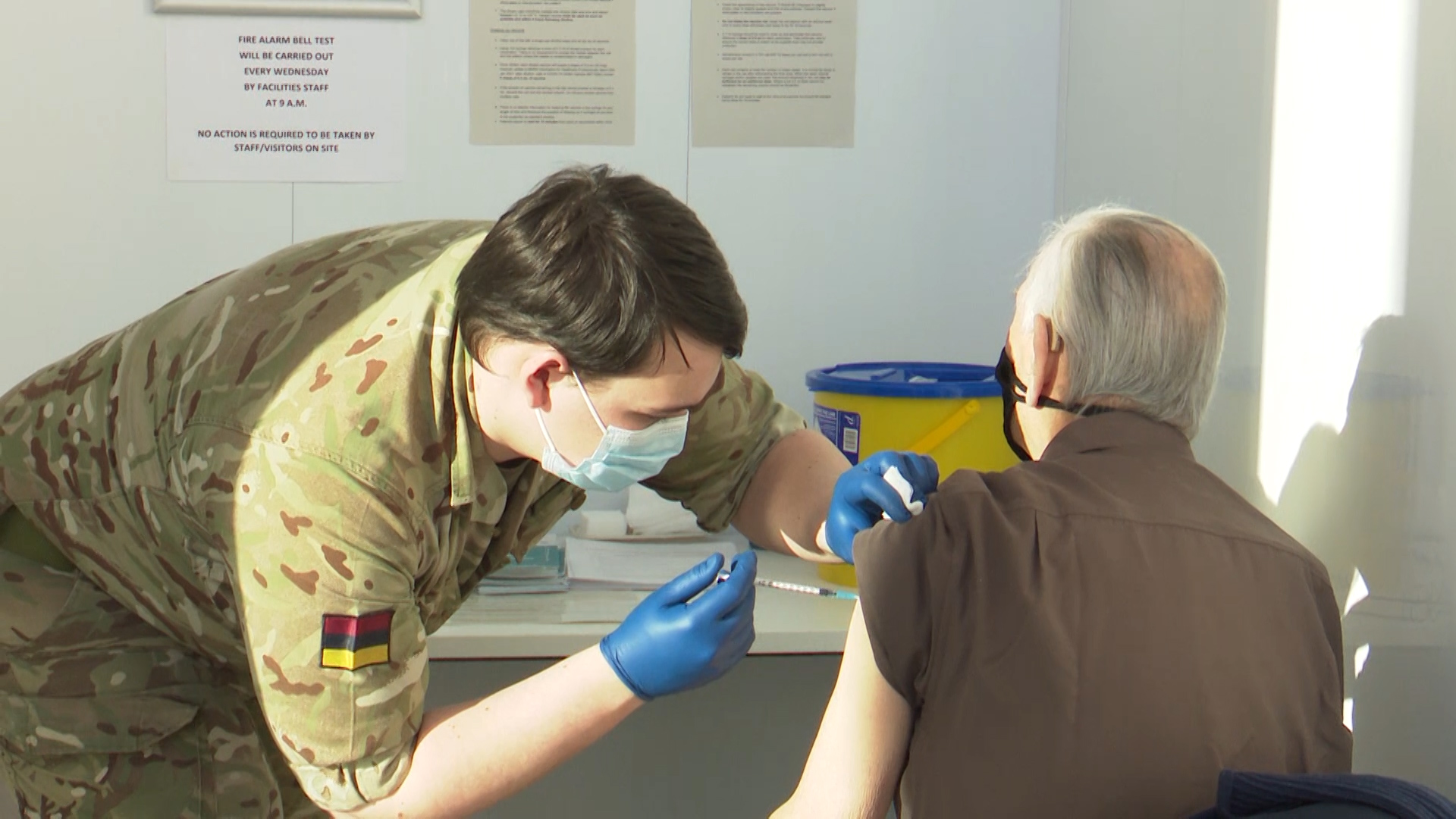 A member of the Armed Forces adminstering a COVID-19 vaccine in Scotland.