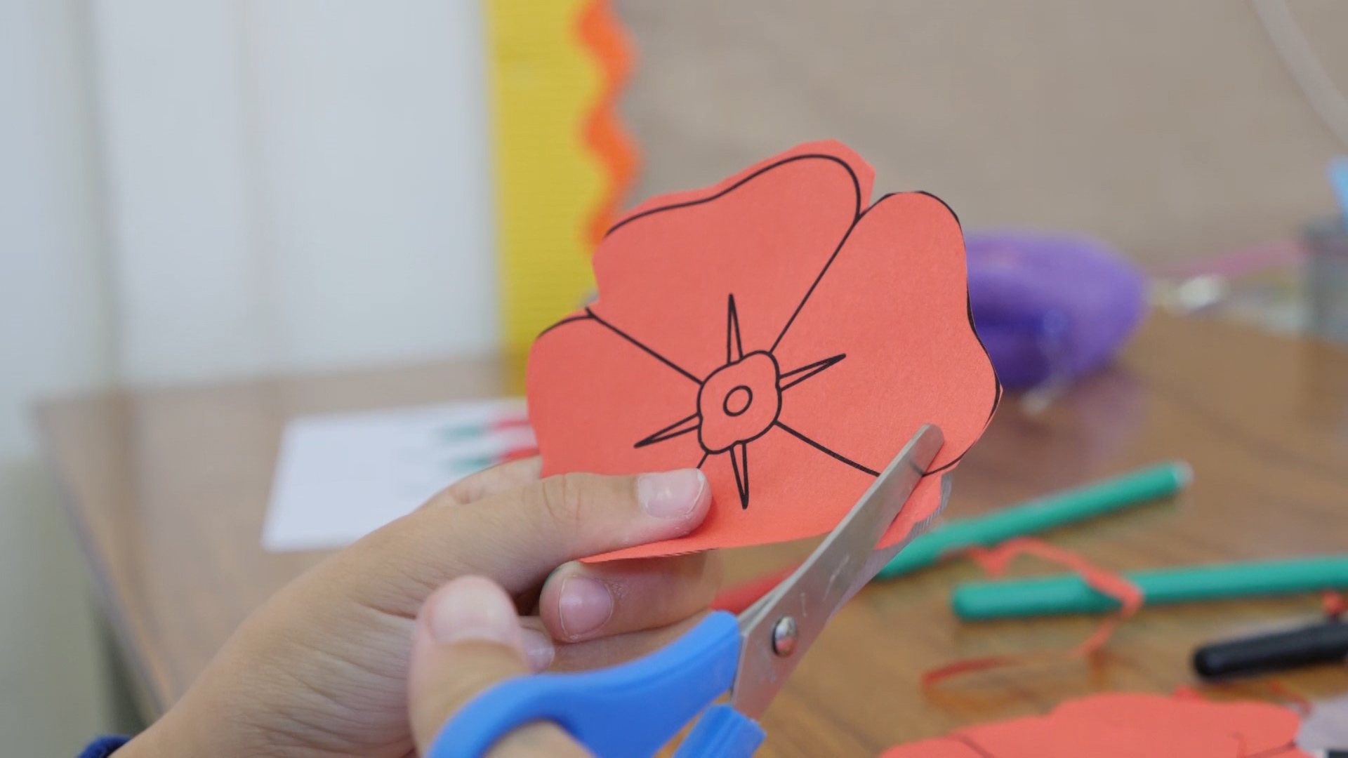 A pupil cutting their poppy.