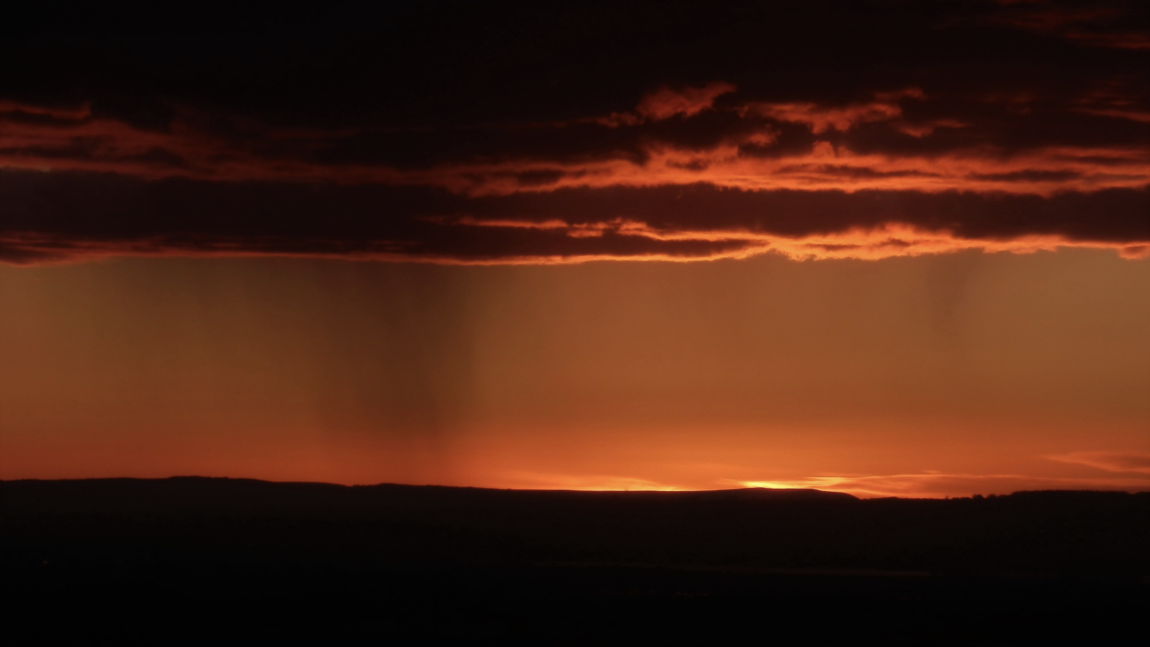 A raincloud with the River Severn in the foreground. Taken from western edge of Cotswolds (Picture: Giles Harrison, University of Reading, 2020).