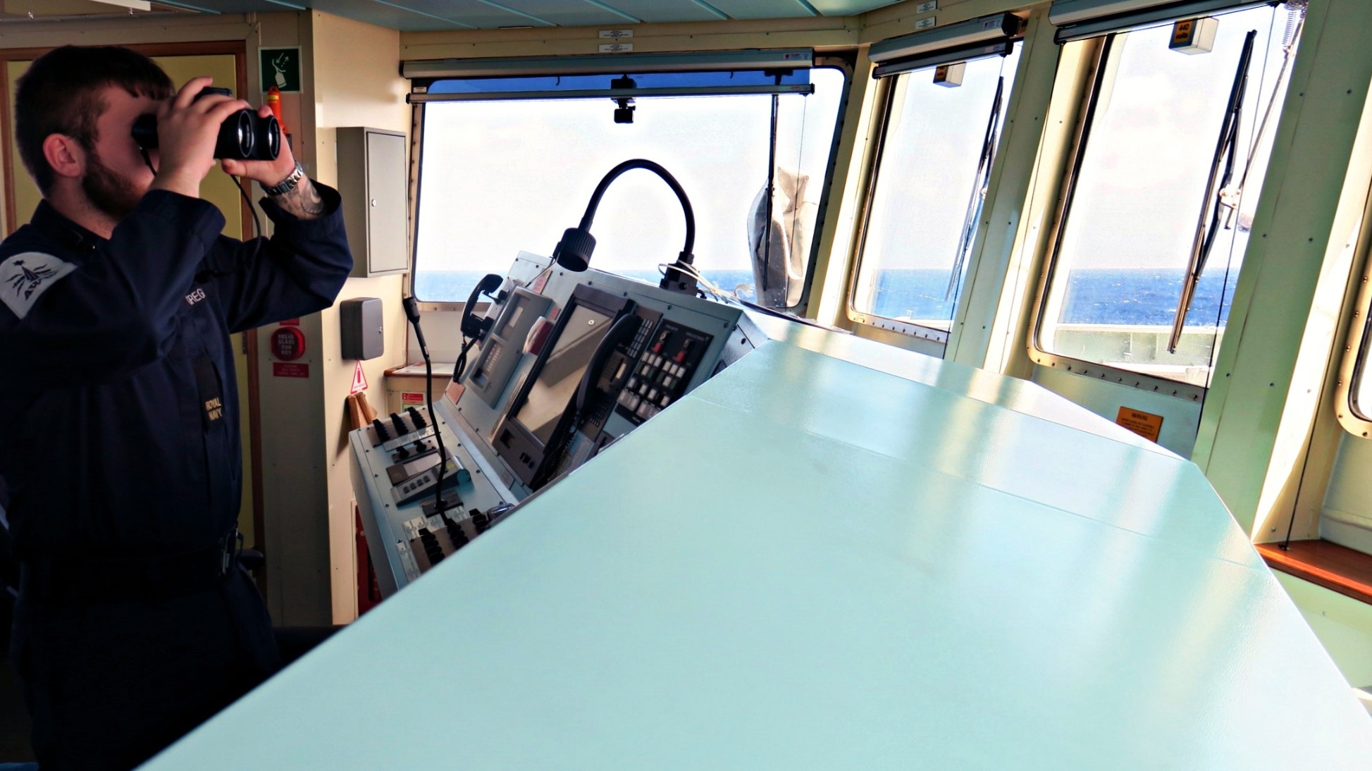 sailor on HMS Tamar's bridge scans the East China Sea (Picture: MOD).