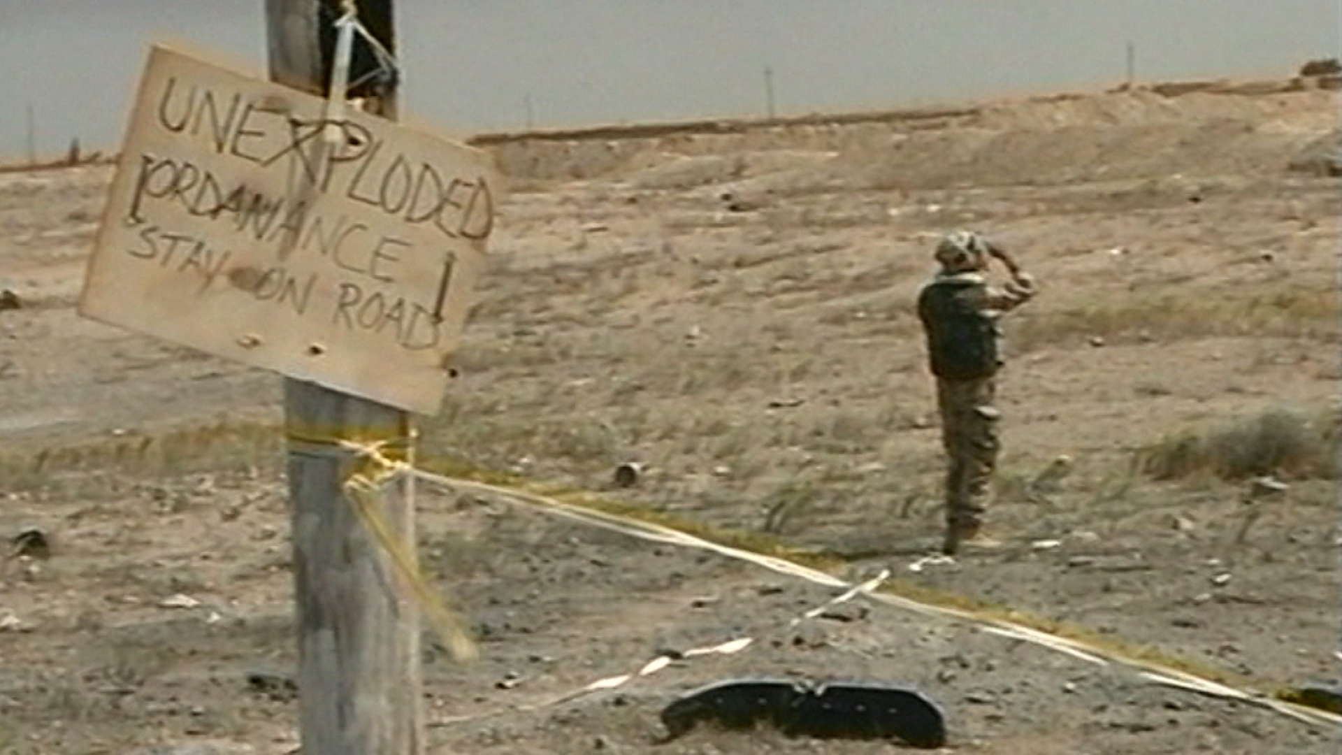 A sign warns of IEDs in Iraq.