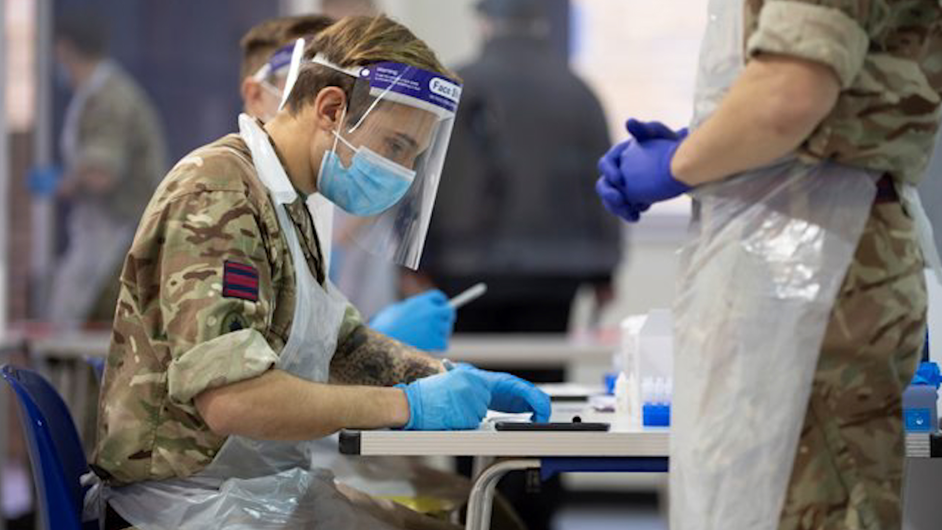 Cover image: A soldier assists with coronavirus testing in Kent last year (Picture: MOD).