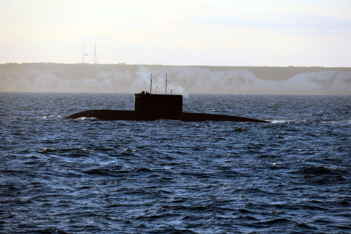 The surfaced Algerian submarine passes the Kent coast while being monitored by HMS Severn (Picture: Royal Navy).