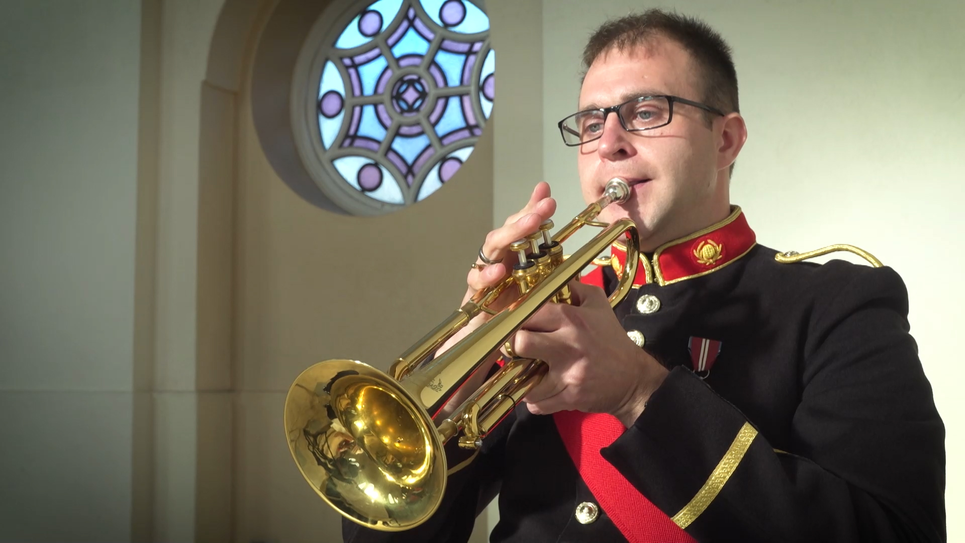 A trumpeter plays Hark the Herald Angels Sing for virtual Admiralty Carols 2020.