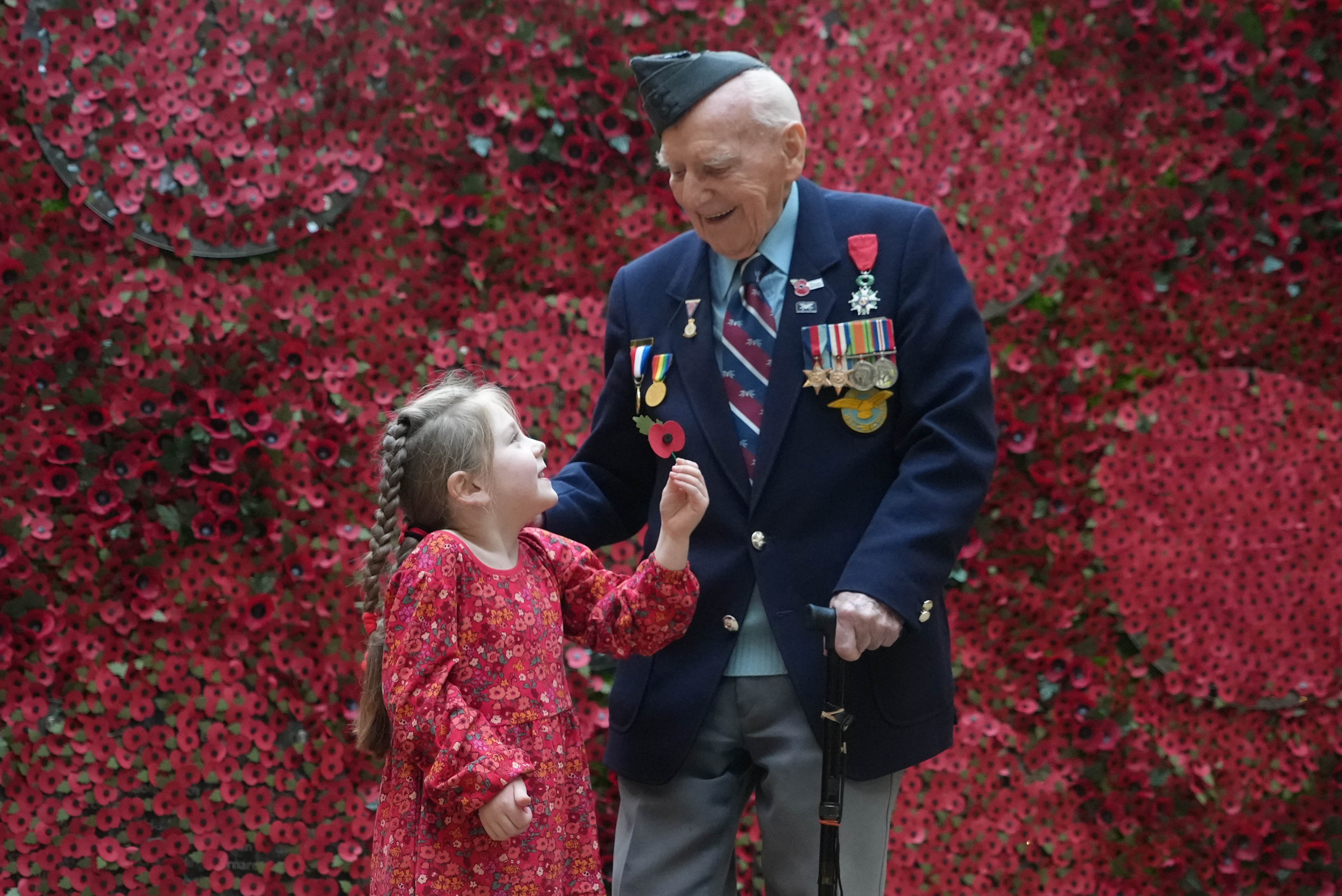 A veteran and a young girl at the launch of the Royal British Legion's 2022 Poppy Appeal 