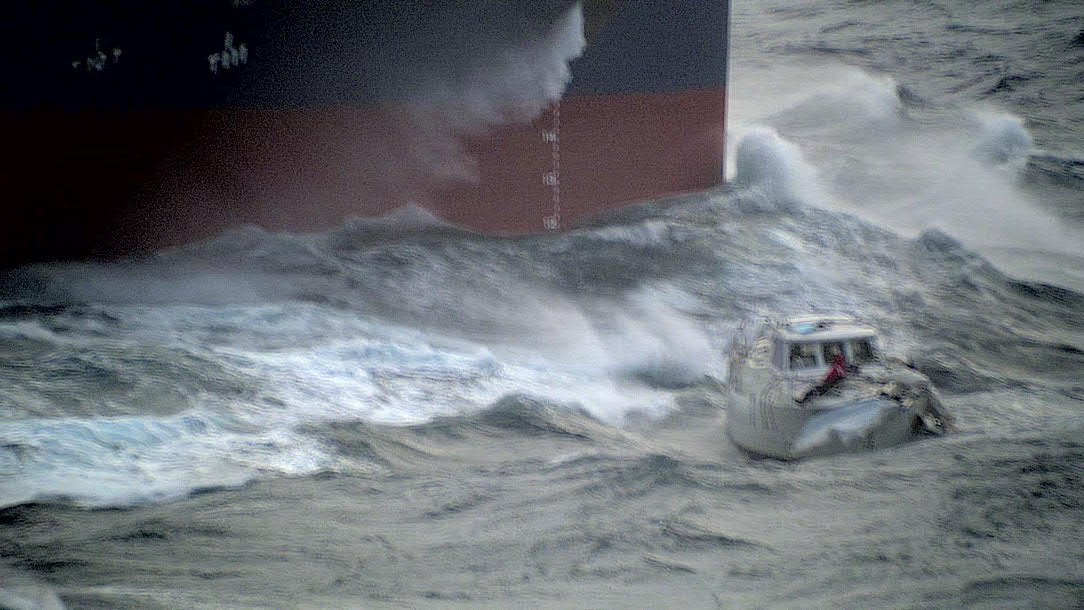 A yacht later rescued by RAF aircraft is battered by Atlantic waves (Picture: Royal Air Force).