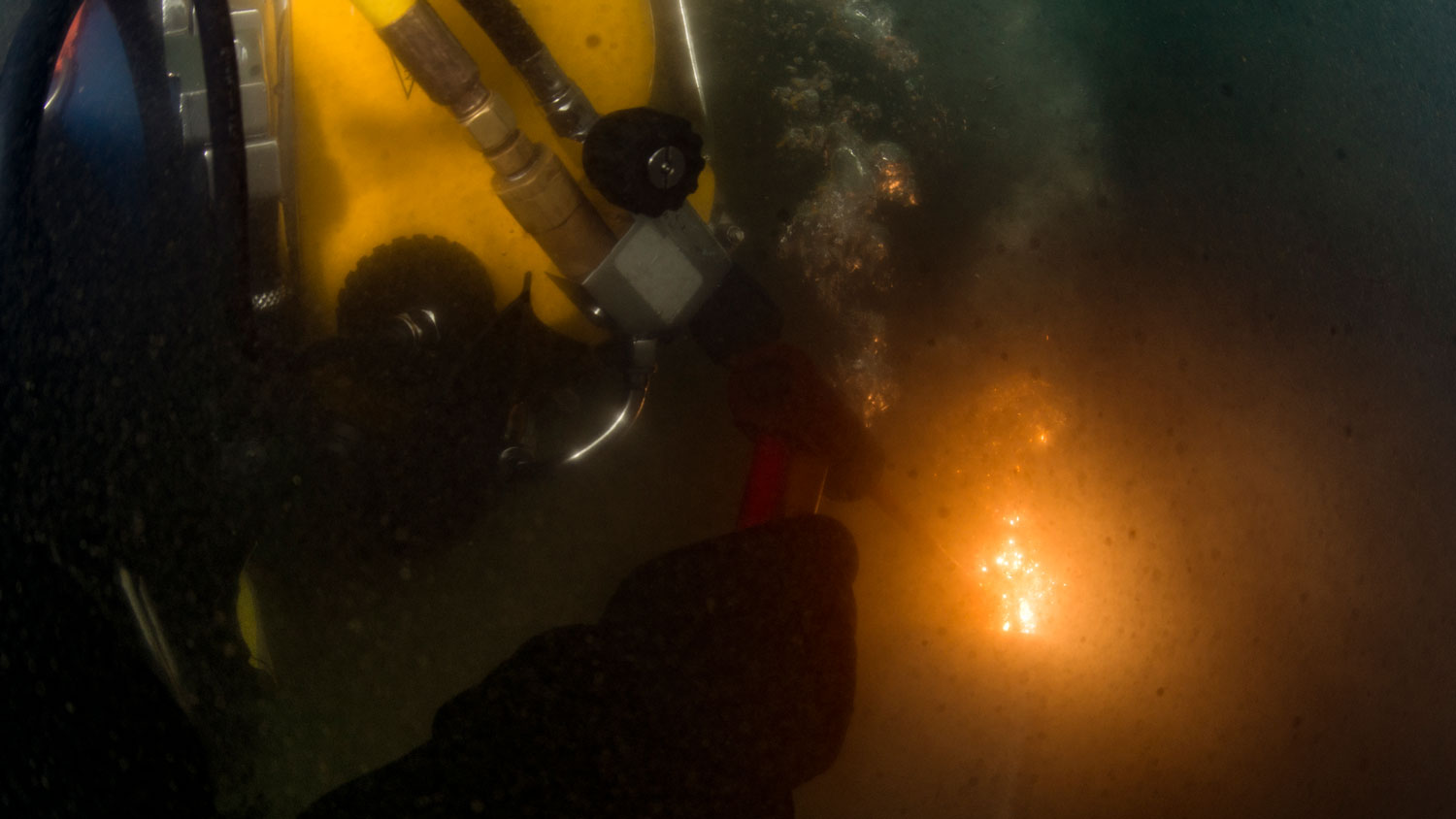 A diver assigned to the Republic of Korea's Underwater Construction Team cuts a piece of steel during a low-visibility during Exercise Foal Eagle in Jinhae, Republic of Korea in 2017 CREDIT US Navy