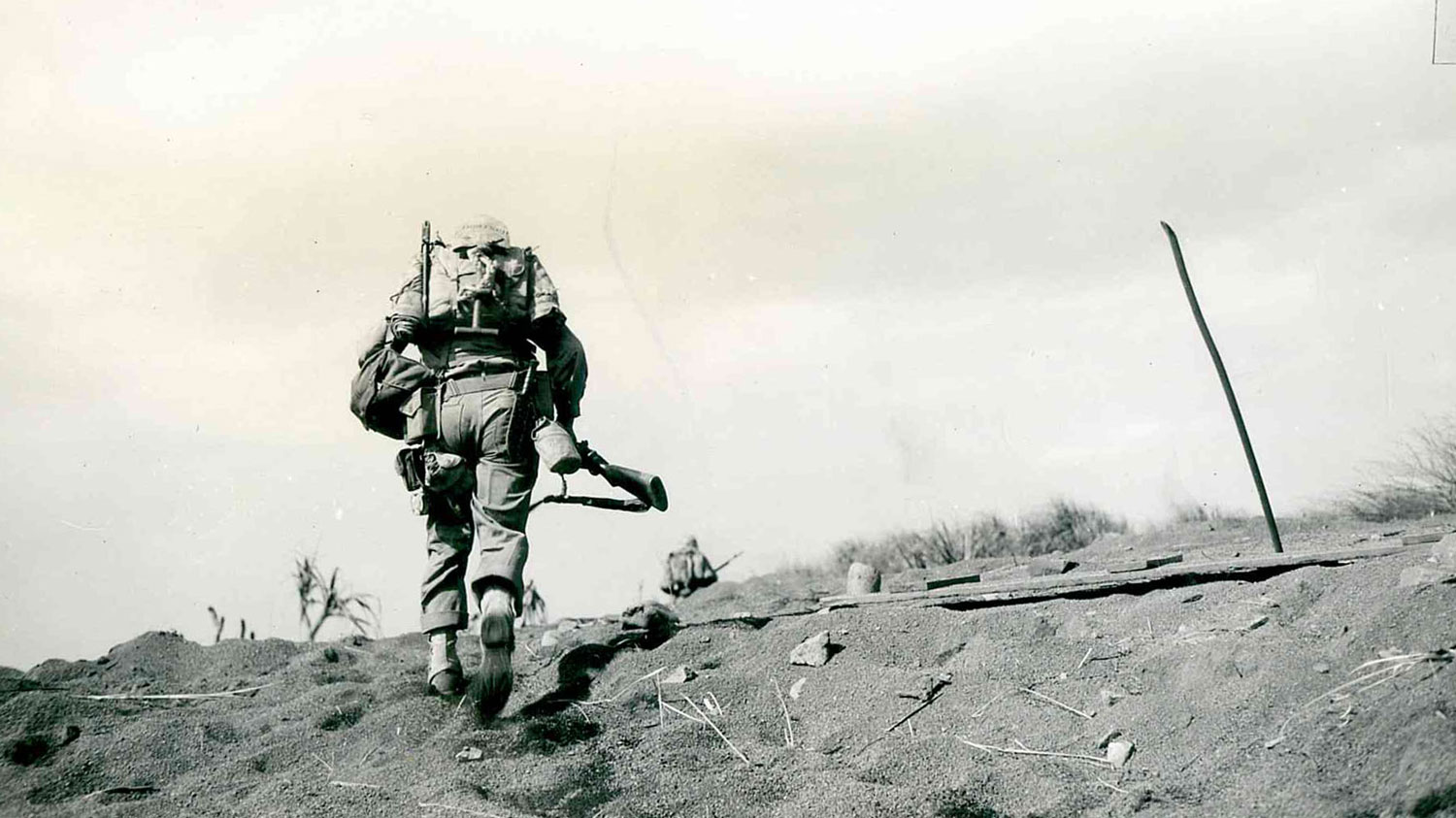A US Marine charges in the face of intense enemy fire during the Battle of Iwo Jima CREDIT National Archives and Records Administration