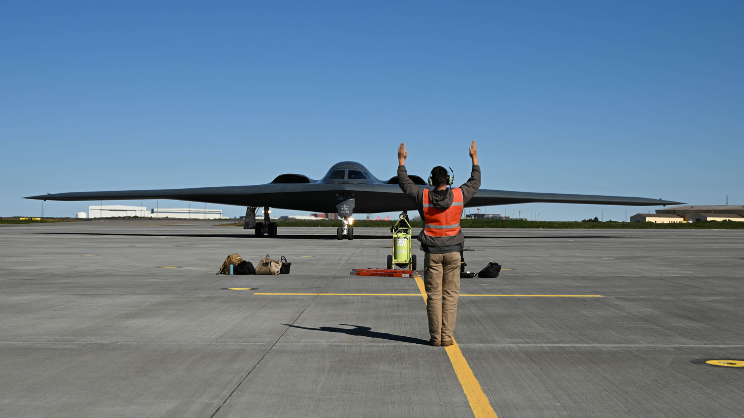A crew chief ushers a US Air Force B-2 Spirit in Iceland to participate in a Bomber Task Force Europe operation, 13 August 2023 CREDIT US Air Force