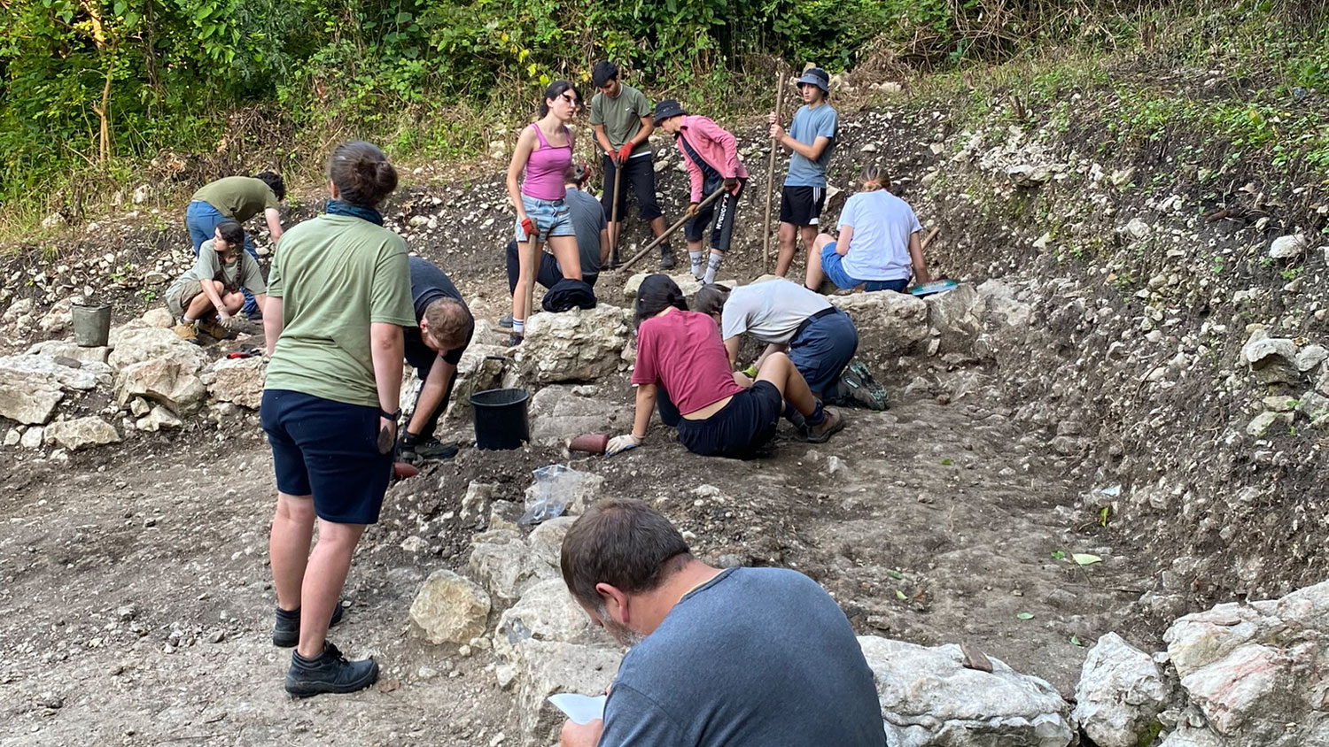 Alastair Eager working in the trench alongside students and volunteers of the Anglo-Georgian Expedition to Nokalakevi CREDIT Dr Paul Everill