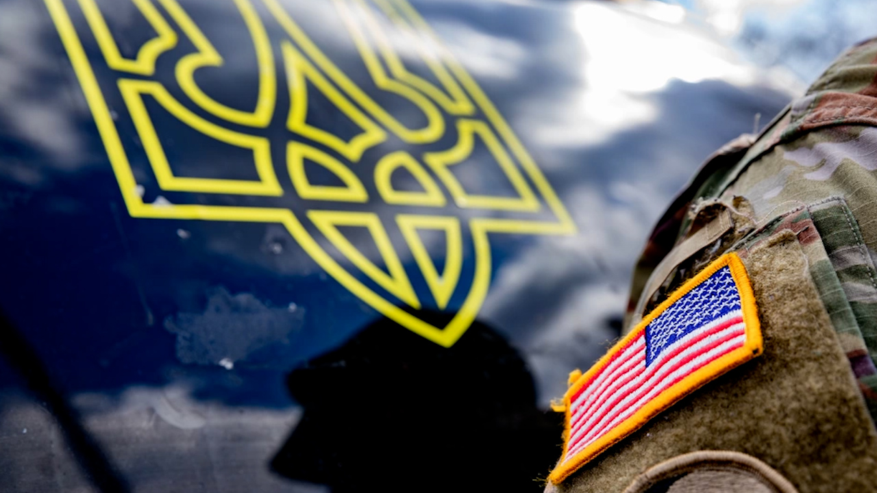 An American flag patch of a Connecticut Army National Guard soldier is visible in the foreground next to a sticker of the coat of arms of Ukraine at Stones Ranch Military Reservation in 2022 (Picture: DoD/ US Army photo by Sgt. Matthew Lucibello). 