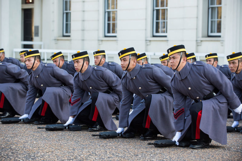 Gurkhas grounding their arms prior to presenting their Kukri's at Wellington Barracks in London.