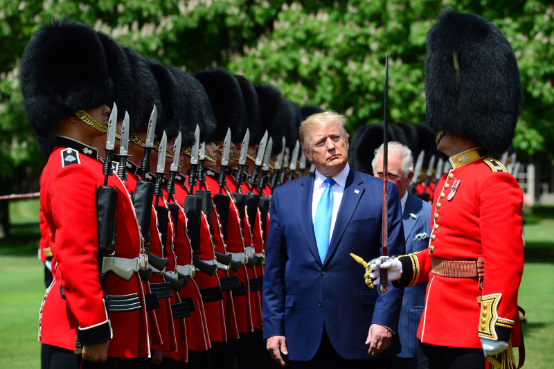 President of the United States Donald Trump, His Royal Highness Prince Charles and Captain of the Guard Major Hamish Hardy (right), inspect the Guard of Honour at Buckingham Palace.