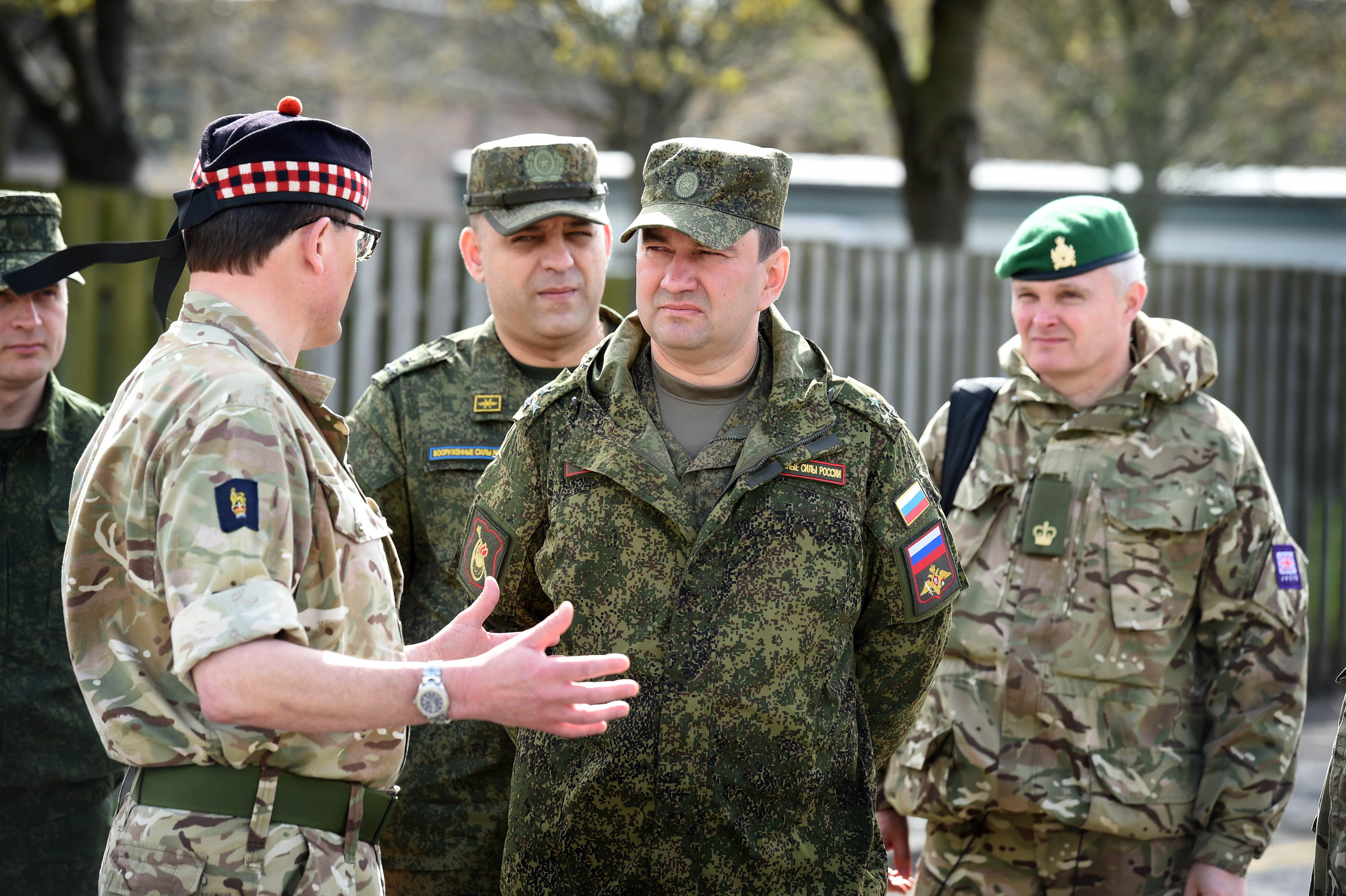Colonel Charlie Wallace (left) giving Russian personnel a guided tour of the facility at Stirling