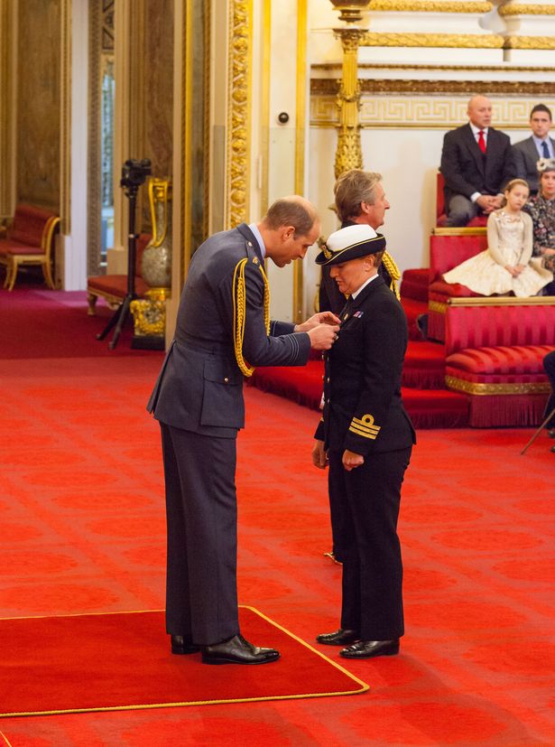 Admiral Jude Terry being awarded the OBE by the Duke of Cambridge