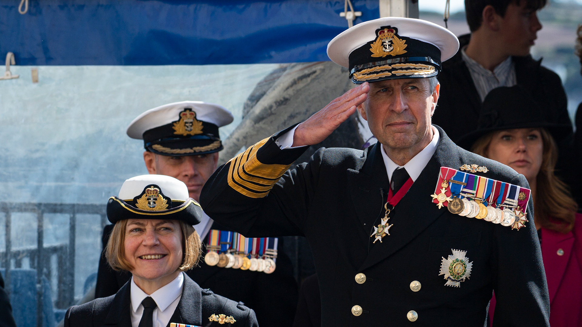 Admiral Sir Keith Blount saluting the passing out officer cadets at BRNC Dartmouth