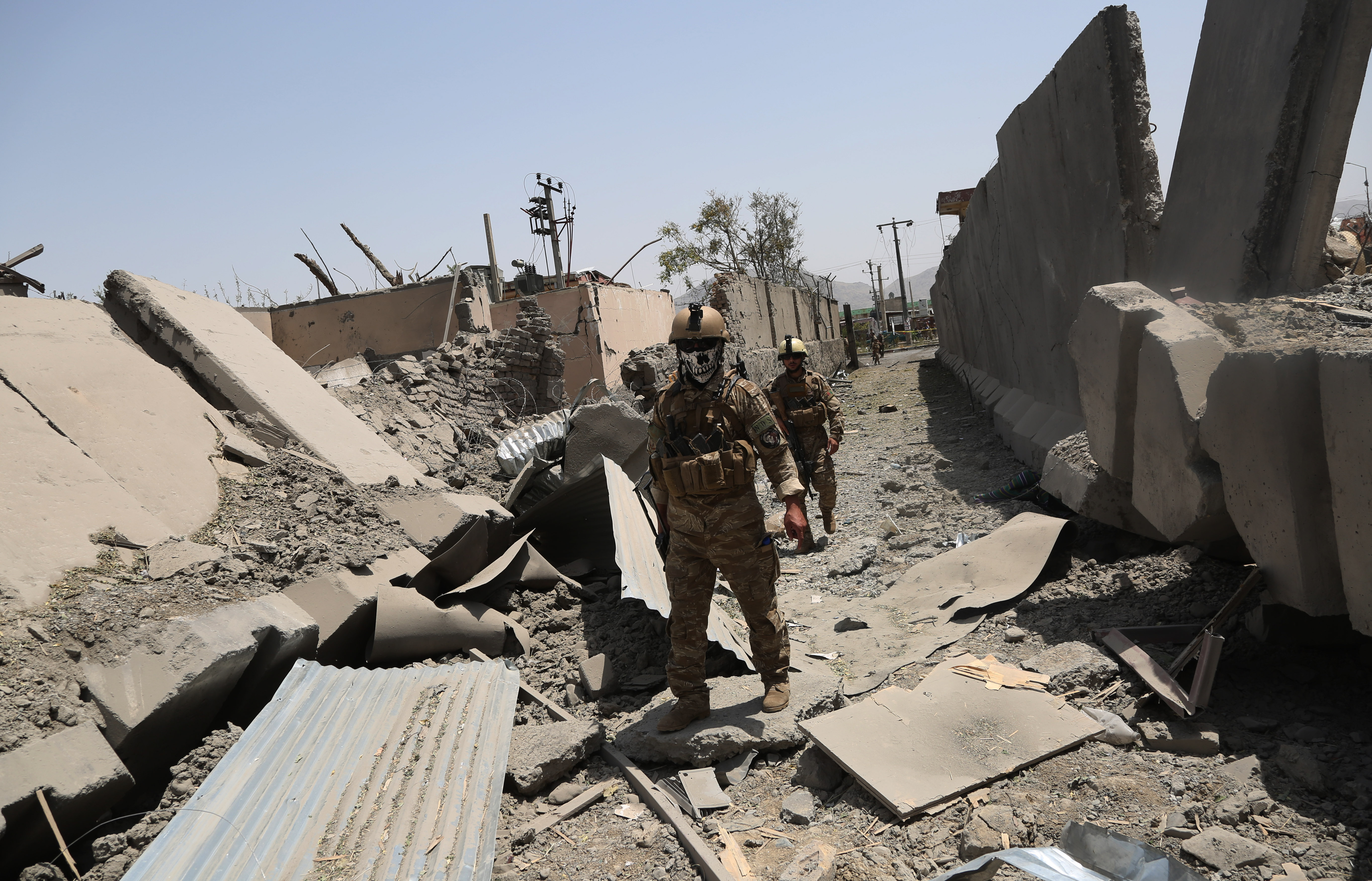 Afghan security force members inspect at the site of an explosion in Kabul, Afghanistan 070819 CREDIT PA