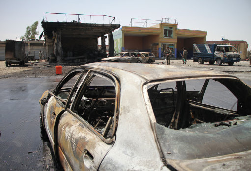 Afghan security force members inspect the site of a blast in Nangarhar province, Afghanistan, in July (Picture: PA).