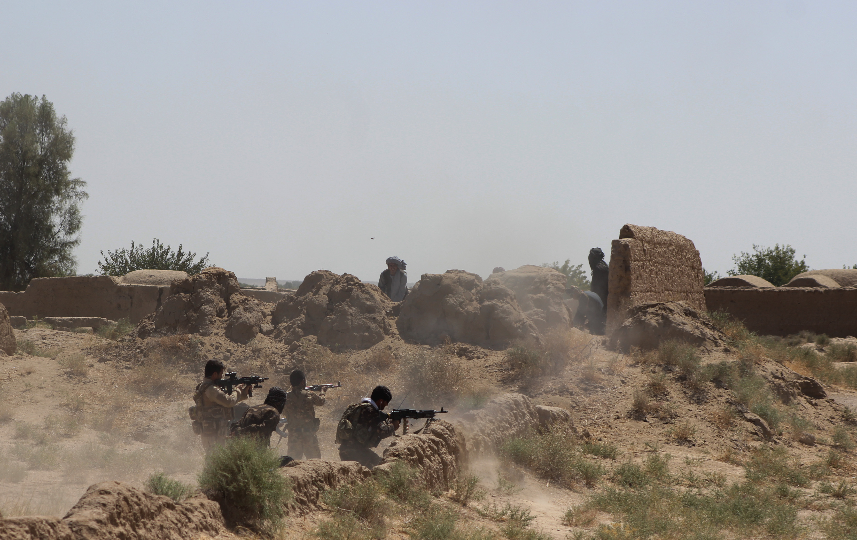Afghan security force members take part in a military operation against Taliban in Helmand Province, Afghanistan