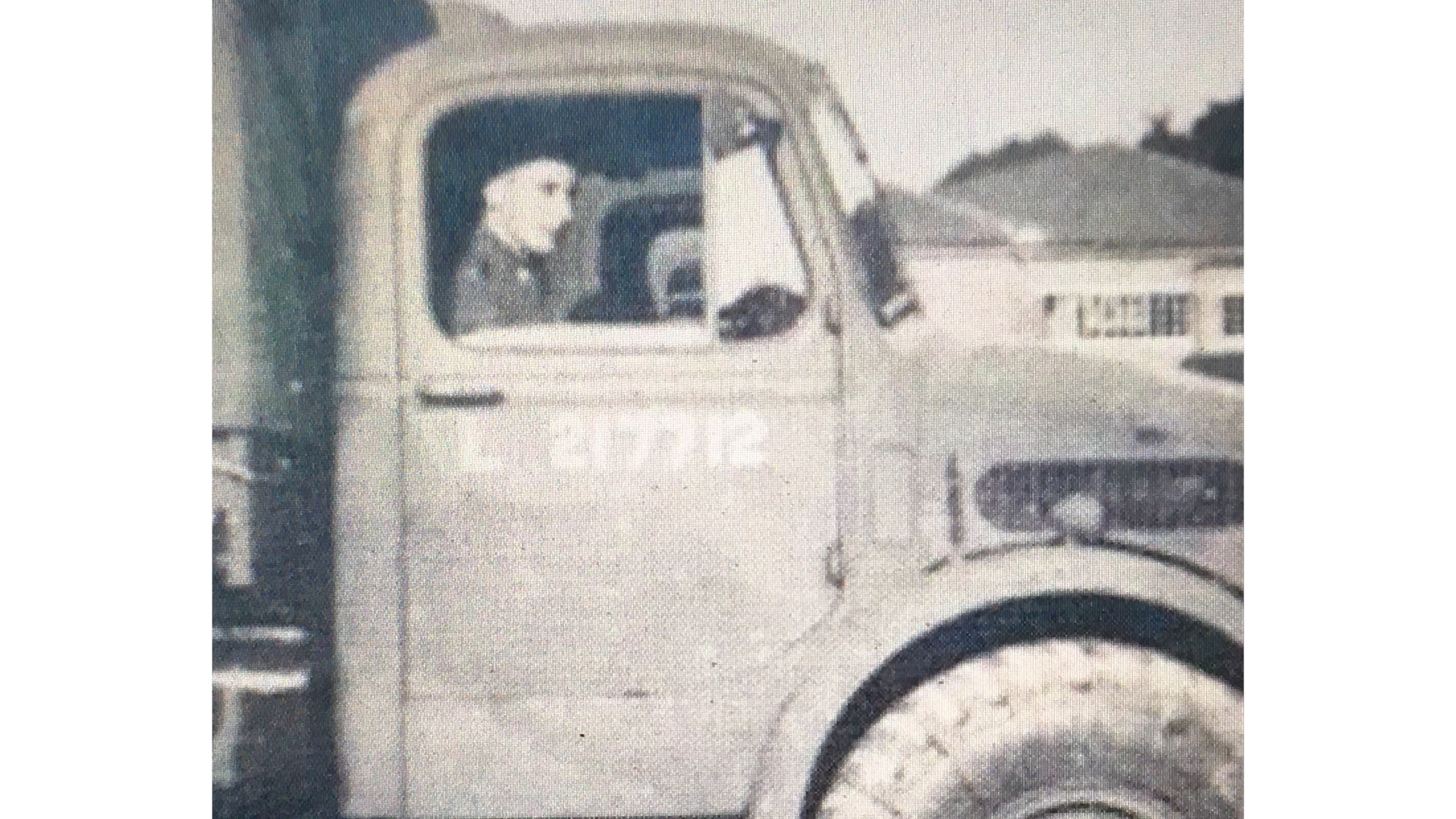 Alfred Smith looking out of a vehicle window