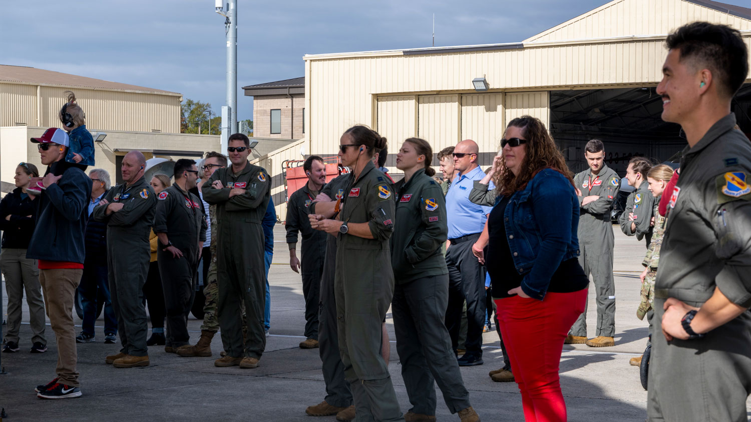 USAF pilots assigned to the 4th Fighter Wing, along with their friends and families, wait on the flightline for Maj McElroy CREDIT US Air Force AND Senior Airman Kylie Barrow
