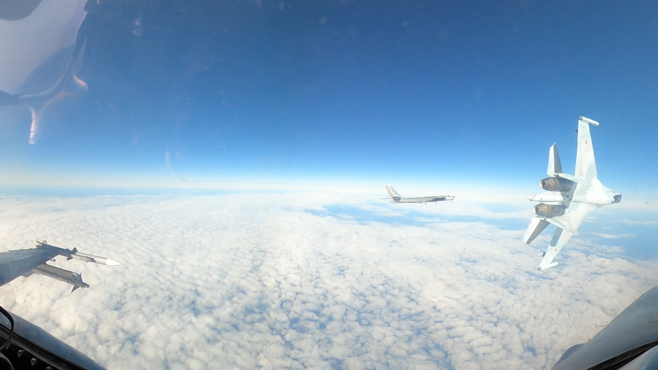 Footage captured by a US F-16 fighter shows a Russian Su-35 flying in an unsafe and unprofessional manner during the mission (Picture: North American Aerospace Defense)