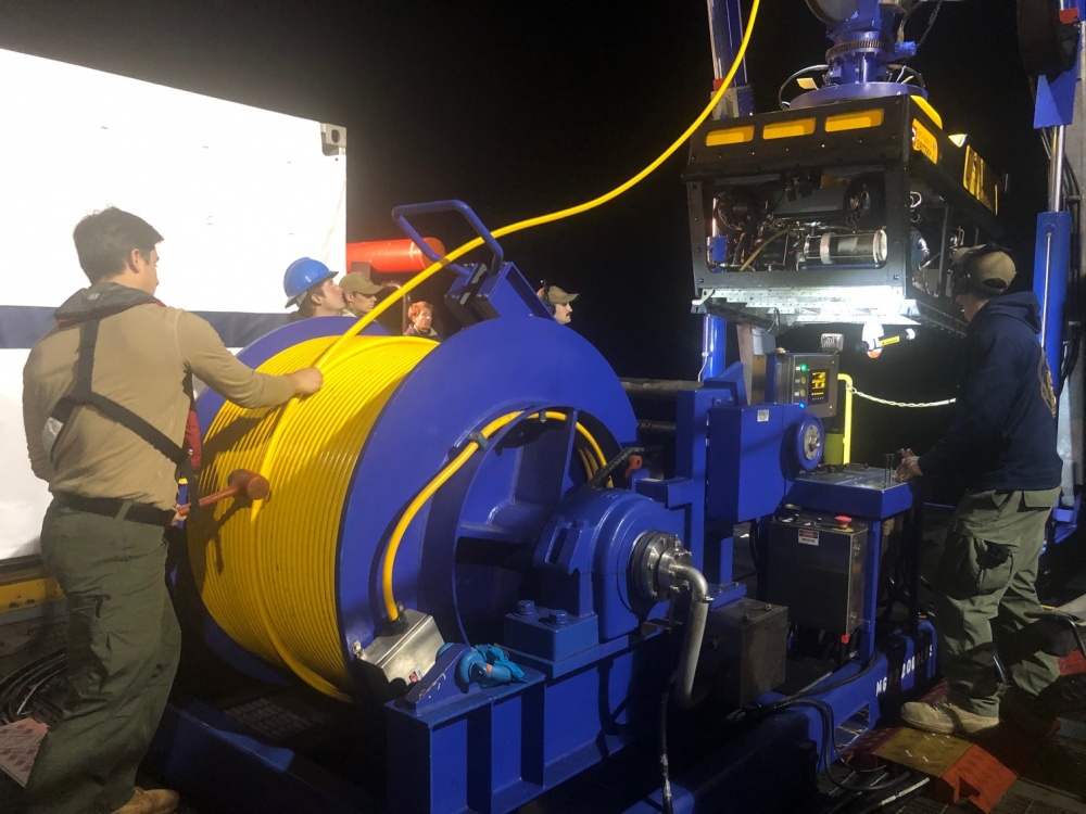 American sailors deploy US Navy Sibitzky Remotely Operated Vehicle (ROV) during search for missing personnel