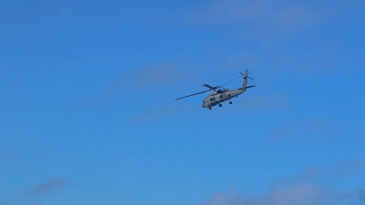 An MH-60R 'Romeo' helicopter from HMAS Brisbane conducts search and rescue operations in the vicinity of Lindeman Island, Queensland, 29 July 2023 29072023 credit Australian Department of Defence.jpg