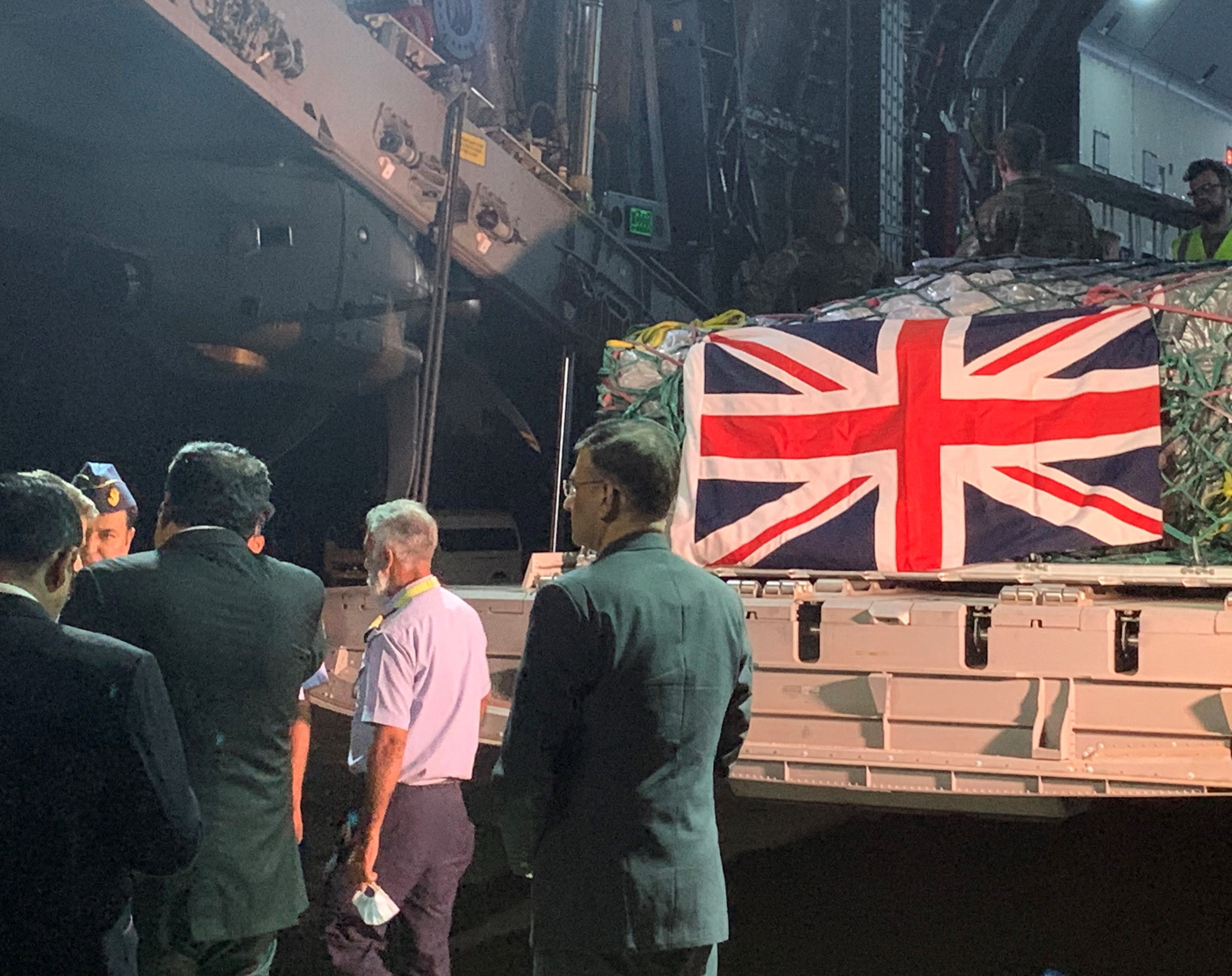 	An RAF Atlas aircraft delivering a military aid package, with a Union Jack, to Pakistan following the floods in the country