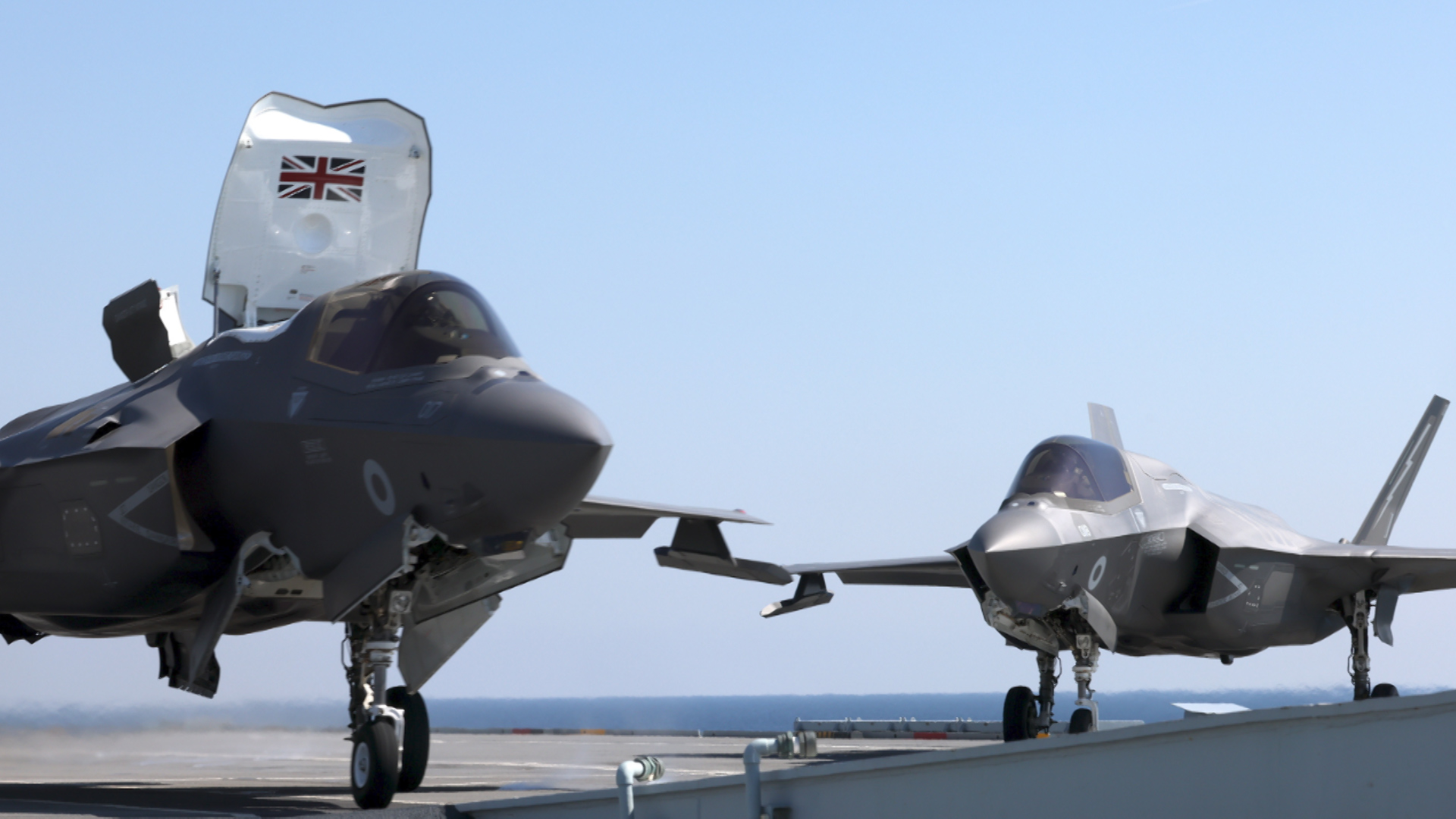 File image of an RAF F-35B fighter jet sitting alongside another F-35B on HMS Queen Elizabeth (Picture: MOD).