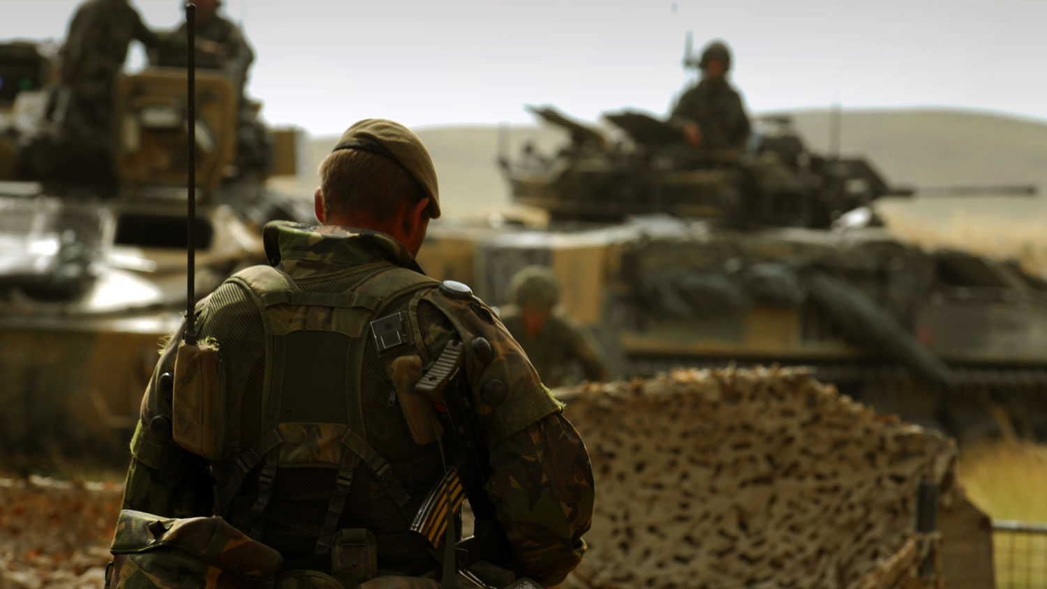 An-anonymous-soldier-walking-towards-Warrior-armoured-vehicles-during-a-training-exercise-