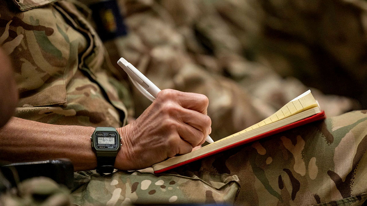 An-anonymous-soldier-writes-note-durings-a-lecture-at-Tidworth-Lecture-Theatre-in-May-2