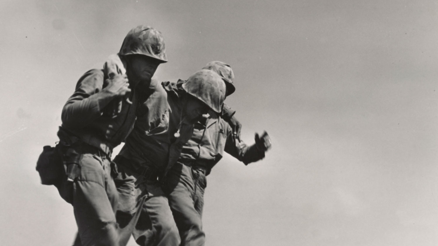 An injured US Marine is carried back to a behind the lines aid staion during the Battle of Iwo Jima CREDIT National Archives and Records Administration