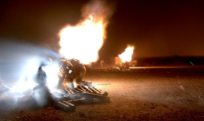 Anonymous British troops launching mortar rounds