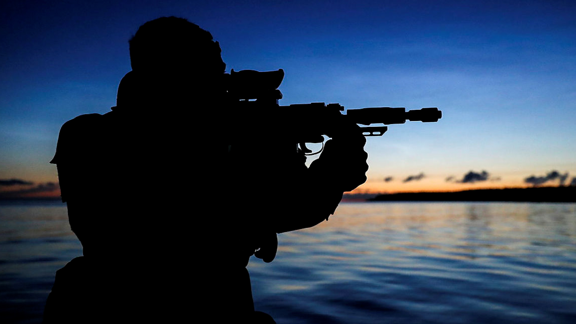 Anonymous Royal Marine from 4 Assault Squadron securing the beach to conduct a recce of the area (Picture: MOD).
