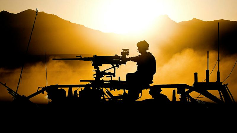 Anonymous Royal Marines of Bravo Company pictured in a Jackal Armoured Vehicle crossing a dusty Afghan sunset 060910 CREDIT MOD