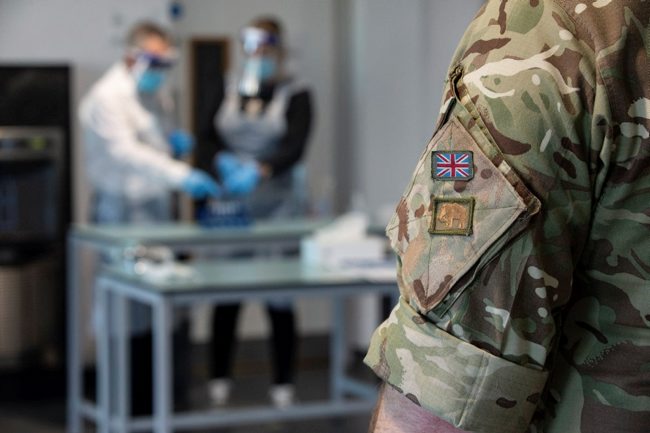 Anonymous member of the Armed Forces, from RAF Wittering, supervising completed coronavirus tests (Picture: MOD).