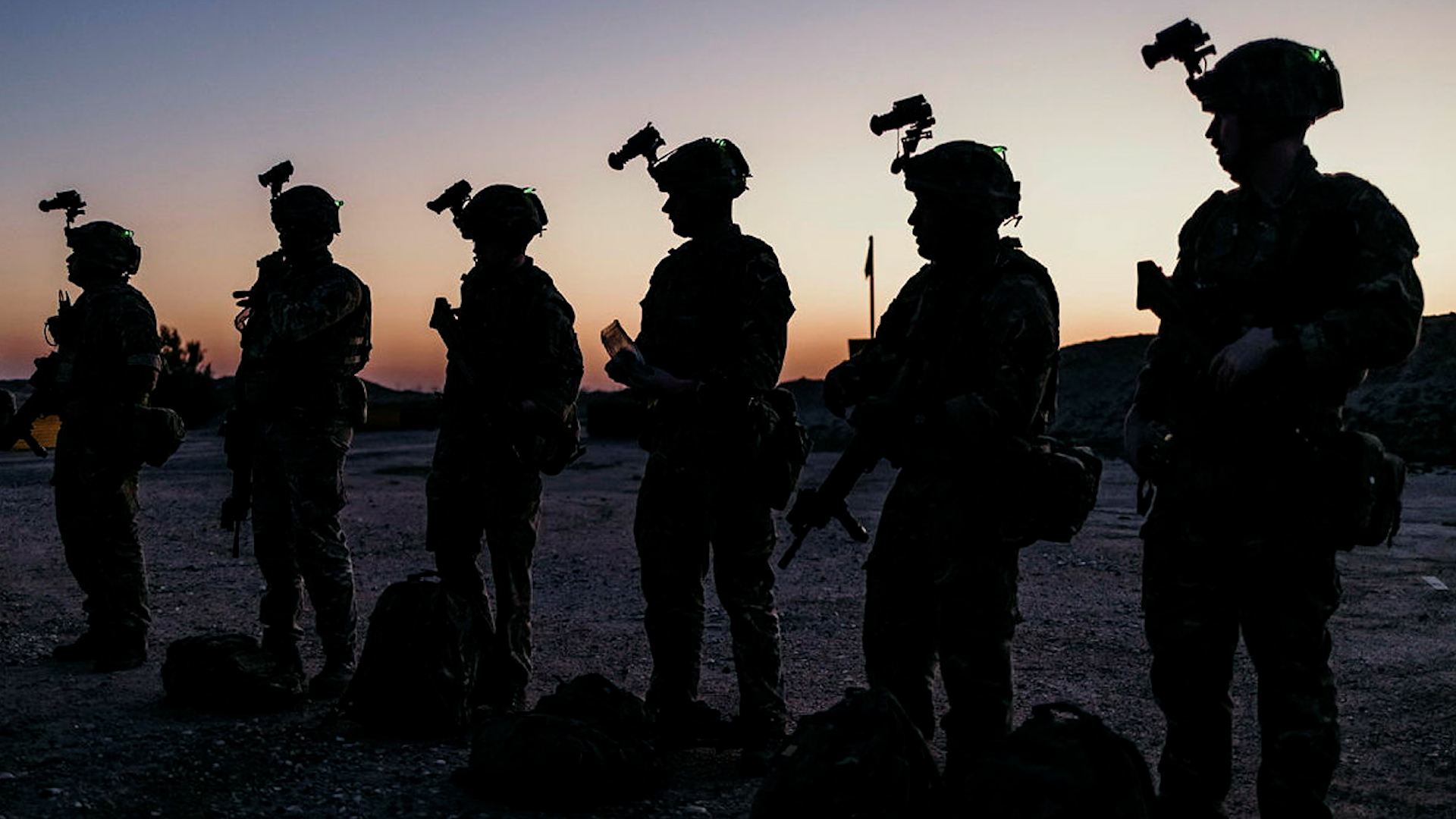Soldiers line up before conducting a night shoot.